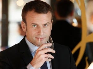 French President-elect Emmanuel Macron noses a glass in a Terre de Vins video.