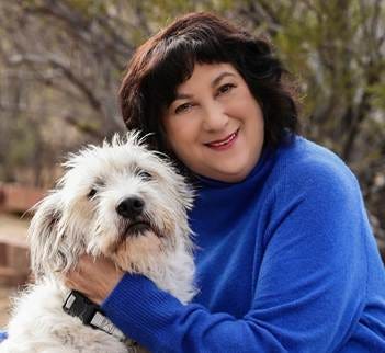 A person holding a dog

AI-generated content may be incorrect.