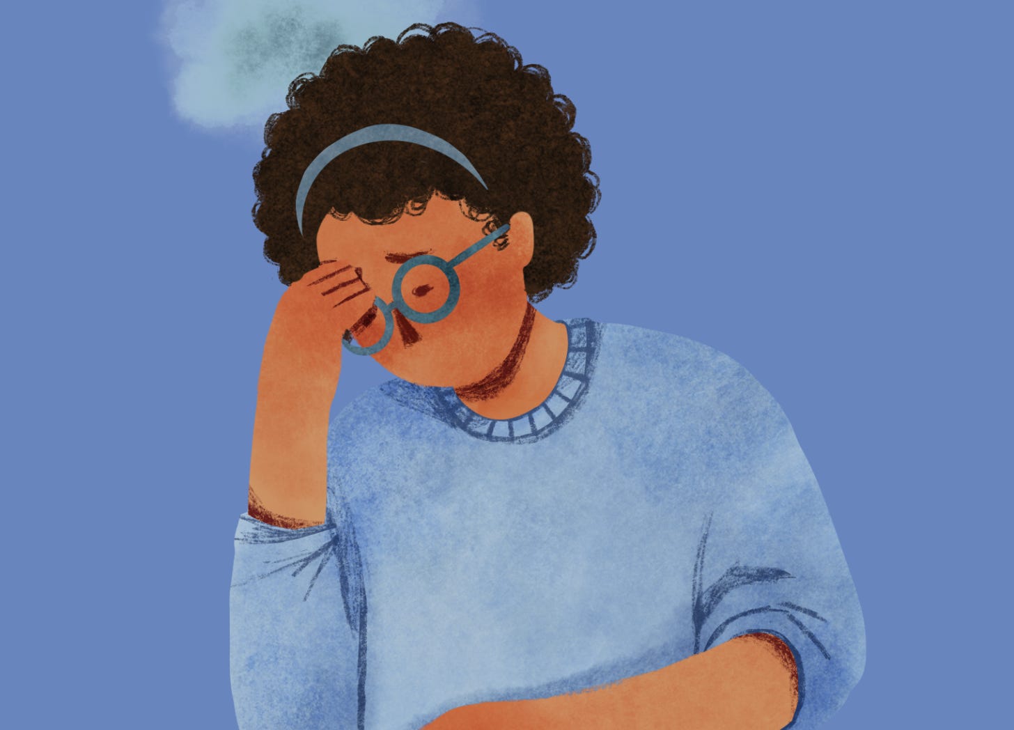 Woman in a blue sweater and glasses, looking down with her hand on her forehead — a quiet moment of emotional overwhelm or reflection.