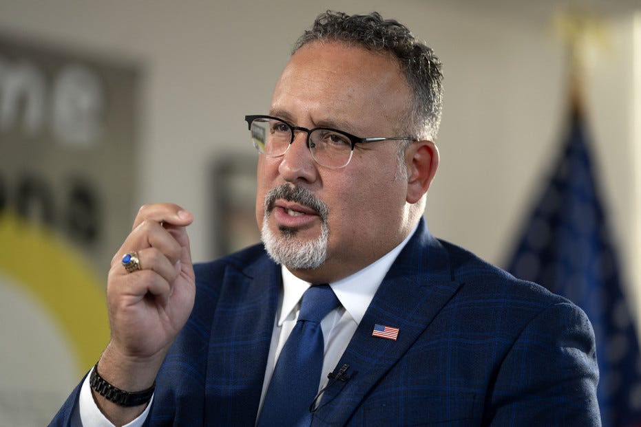 Education Secretary Miguel Cardona speaks during an interview.