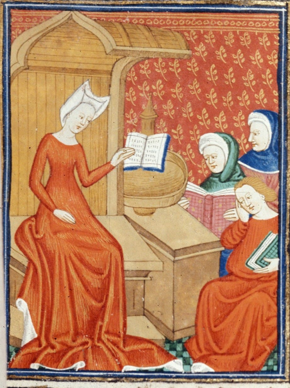 man in red robe painting