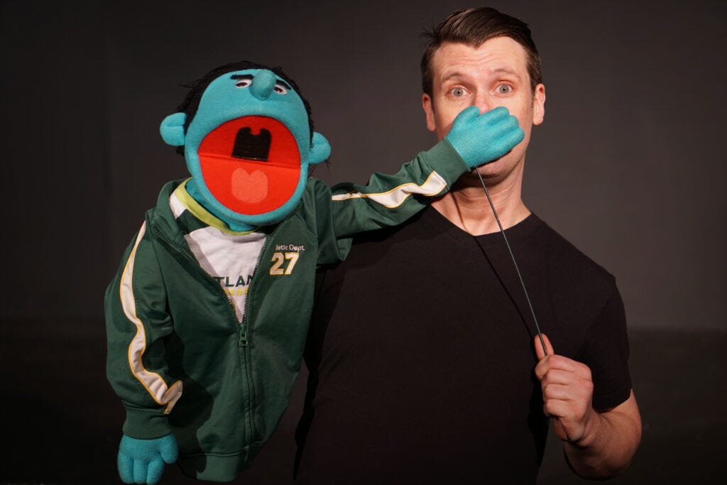A puppet sings in Avenue PDX - Funhouse Lounge. Learn more at https://www.funhouselounge.com/