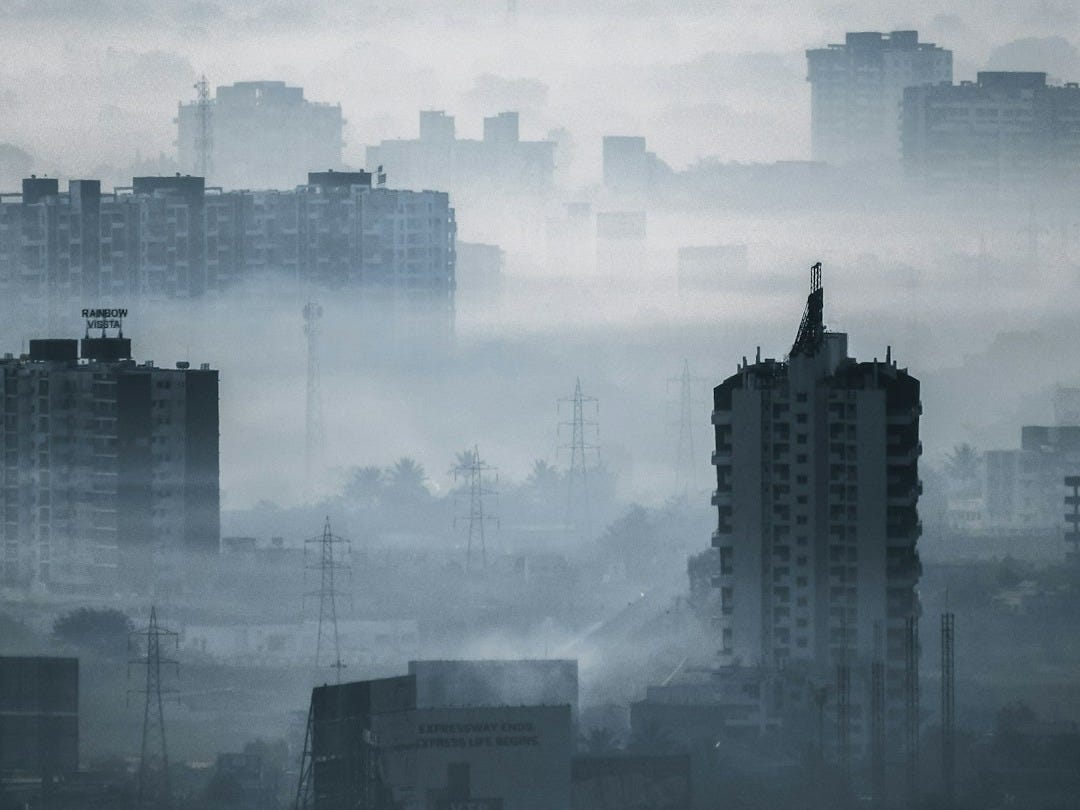 high rise buildings under white clouds during daytime high rise buildings under white clouds during daytime