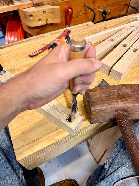 Three-step woodworking process. Left: marking mortise locations on a board with ruler and pencil over woodworking plans. Center: drilling mortises with a drill press. Right: chiseling the mortise by hand with a mallet and chisel.