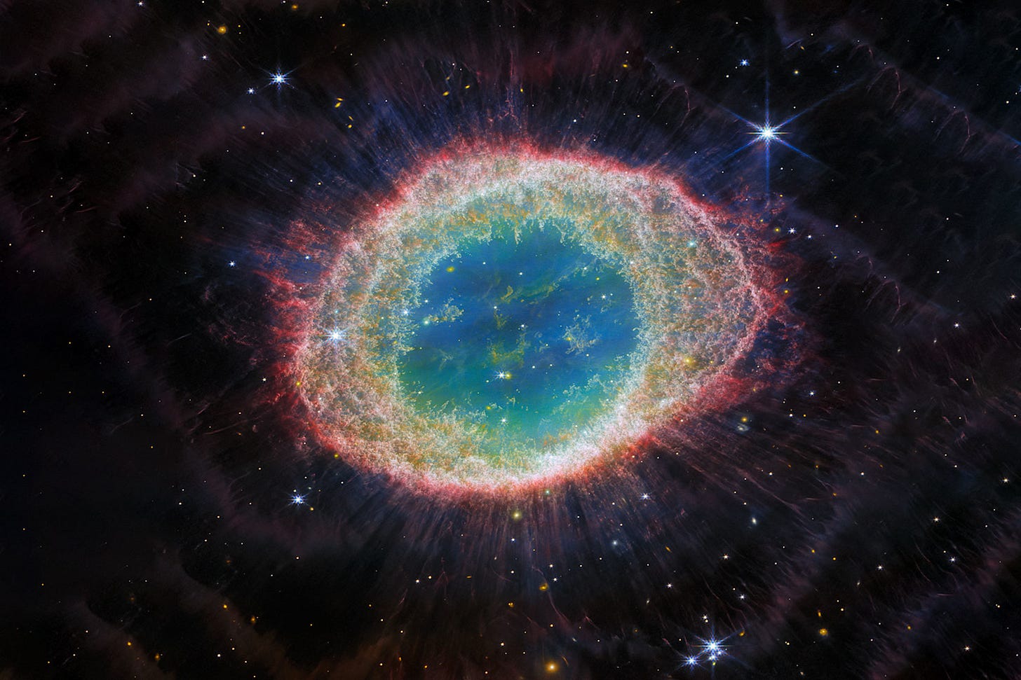 The Ring Nebula shown in vibrant colors captured by the James Webb Space Telescope, illustrating the outer layers of a dying star The Ring Nebula shown in vibrant colors captured by the James Webb Space Telescope, illustrating the outer layers of a dying star