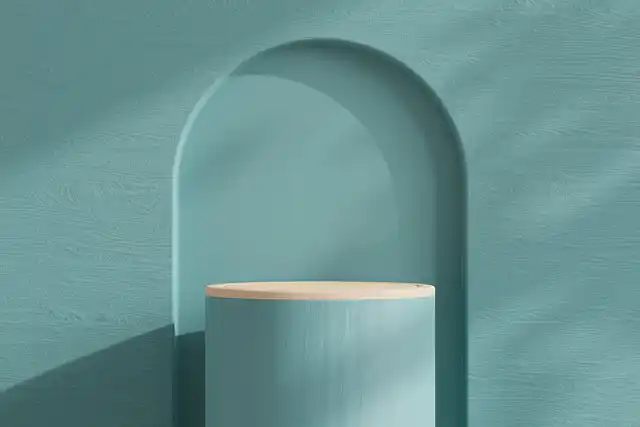 Minimal teal archway and pedestal suggesting a clear niche opening