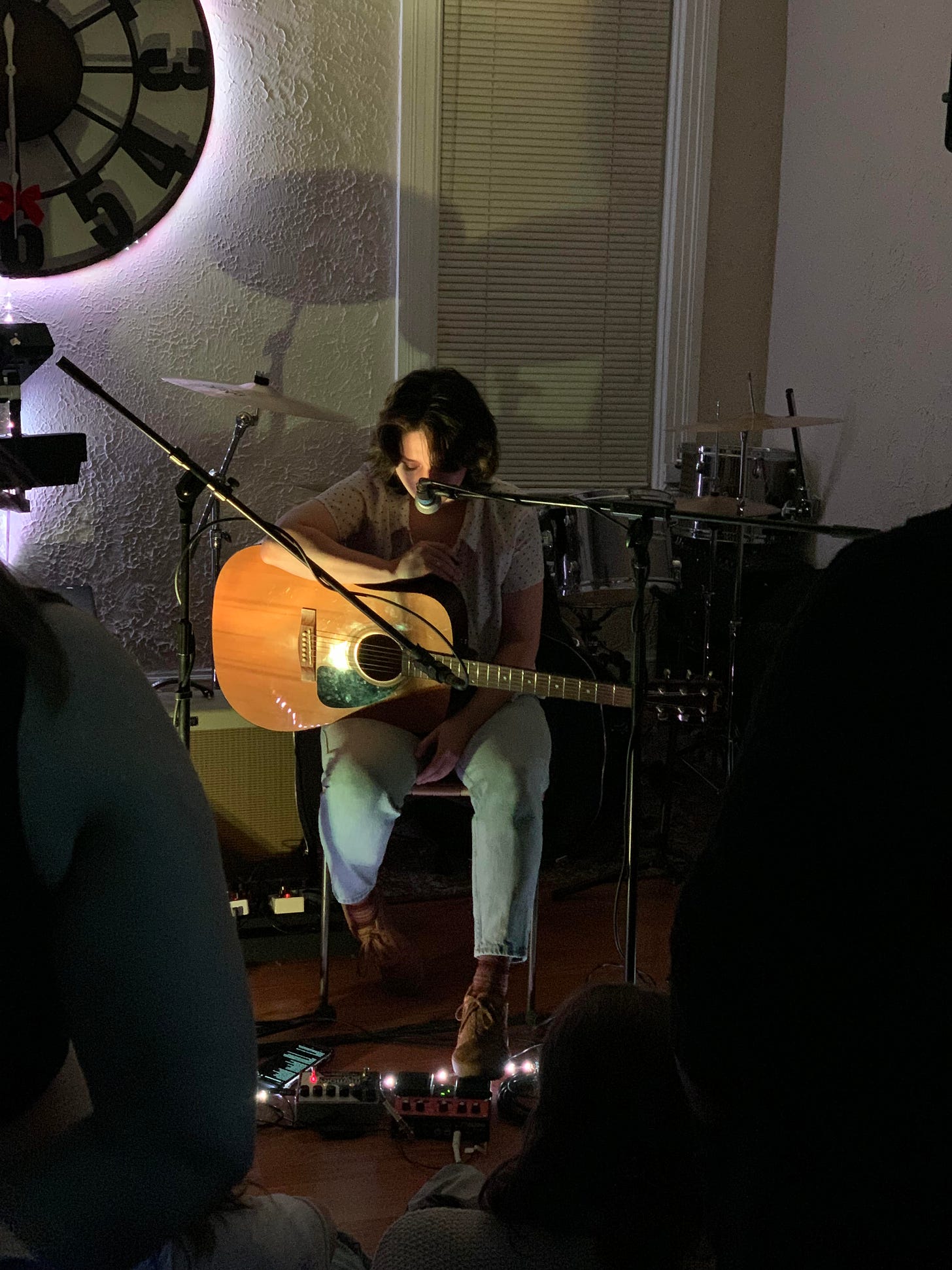 Gabbo playing at 6:30 club, a house venue, solo with a loop pedal at their feet