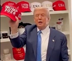 A person in a suit holding a red hat