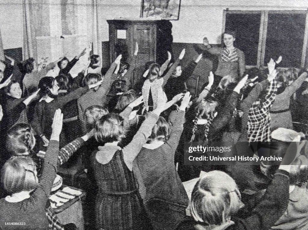 German school children performing the Nazi salute