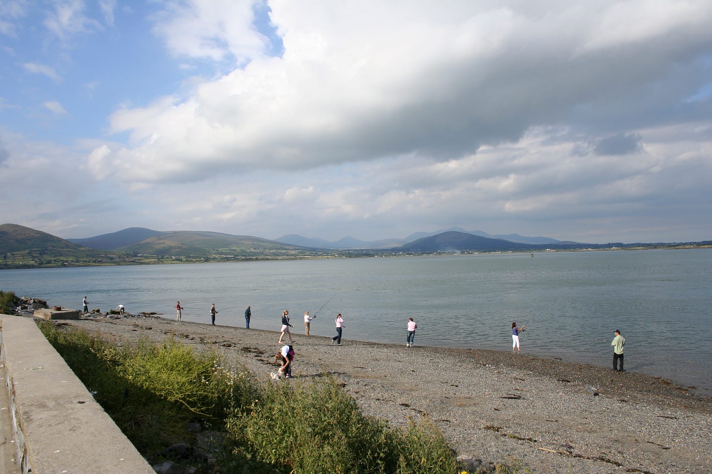 People fishing on the shore of Carlingford Loch People fishing on the shore of Carlingford Loch