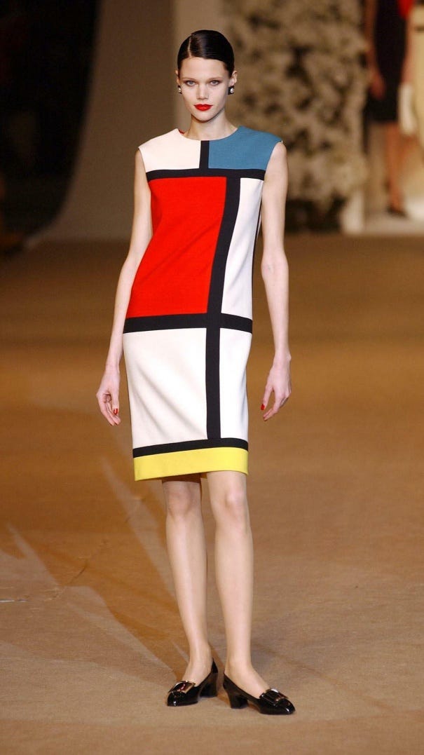 Model on a runway wearing a dress with a Mondrian style color block pattern Model on a runway wearing a dress with a Mondrian style color block pattern