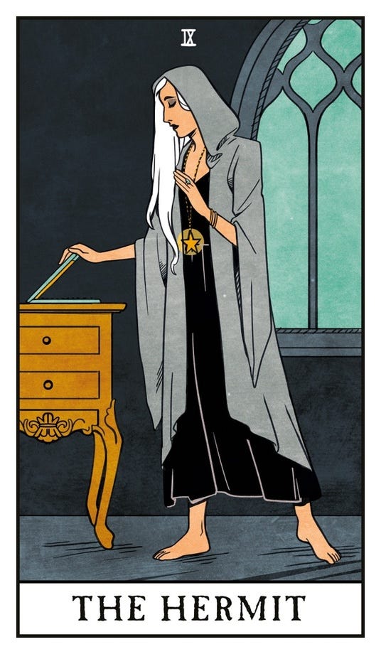 A hermit tarot card featuring a white haired femme person in a grey cloak, standing before a gothic window at twilight. They are closing a laptop and looking thoughtful, their gestures are elegant