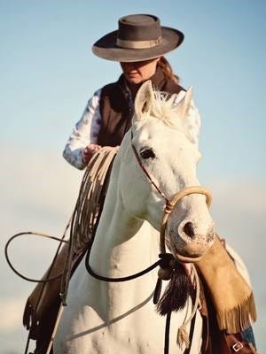 Jane Hedge riding a white horse Jane Hedge riding a white horse