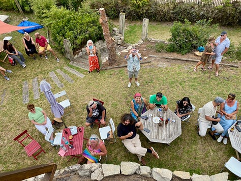 people outside having a party, playing live music and a swimming pool and bbq