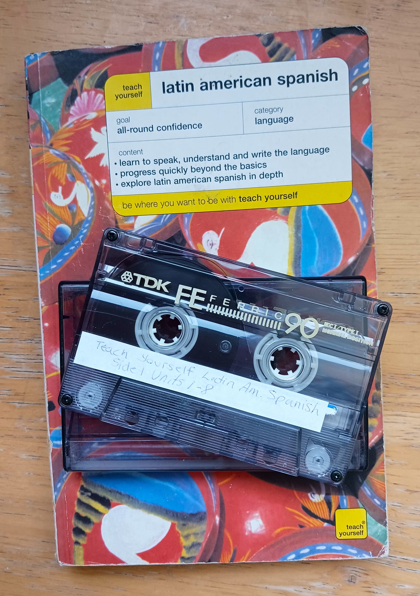 A "Teach Yourself Latin American Spanish" paperback and a cassette tape.