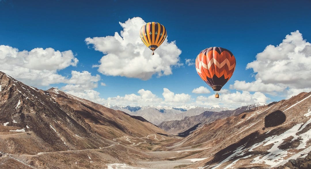 two hot air balloons floating