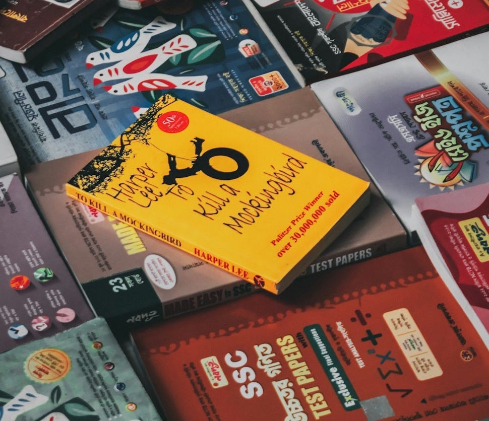 a pile of books sitting on top of each other a pile of books sitting on top of each other