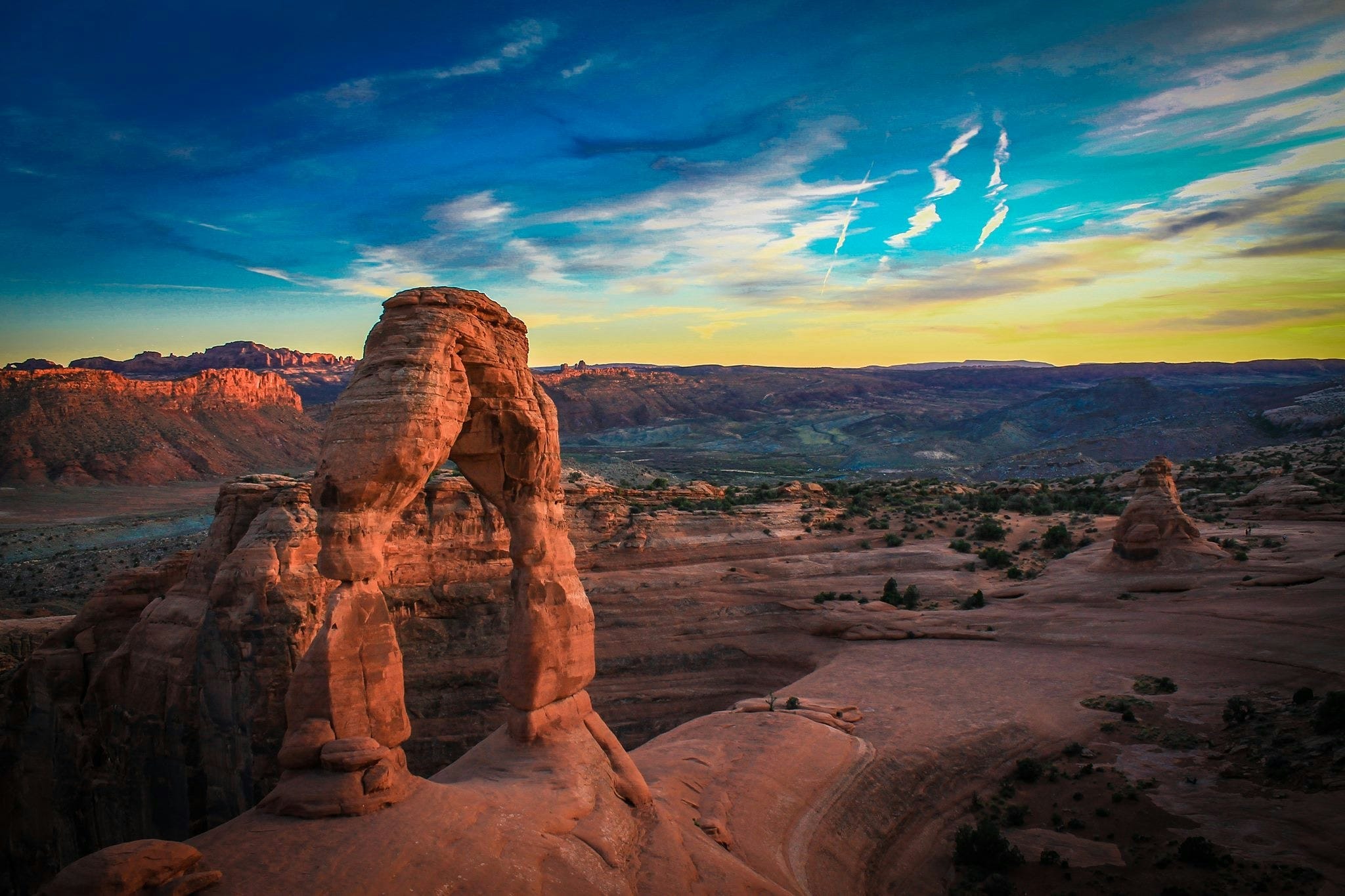 Sunset over arched stone in the desert Sunset over arched stone in the desert
