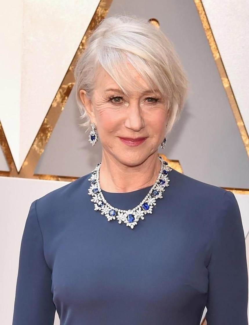 A person with short hair wearing a blue dress and a necklace
AI-generated content may be incorrect. A person with short hair wearing a blue dress and a necklace
AI-generated content may be incorrect.