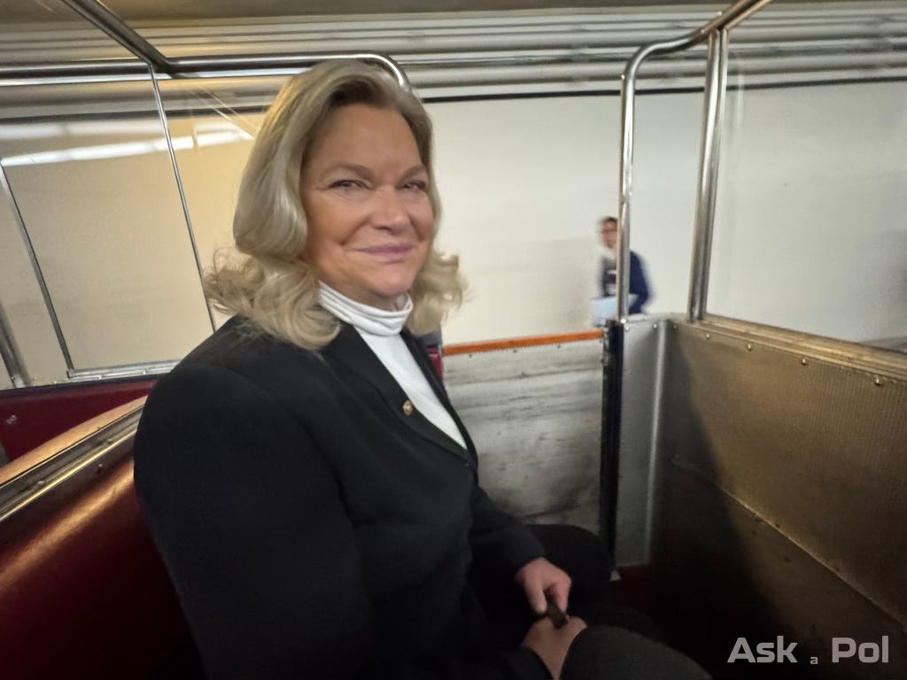 Women smiles riding an underground trolly car Photo: Matt Laslo © www.askapolpolitics.com
