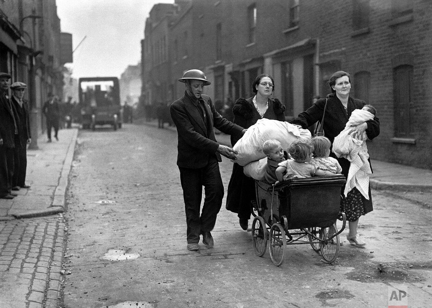 An East London family, displaced and seeking safety, moves to new quarters on September 8, 1940, after their home was destroyed on the devastating opening night of the Blitz.