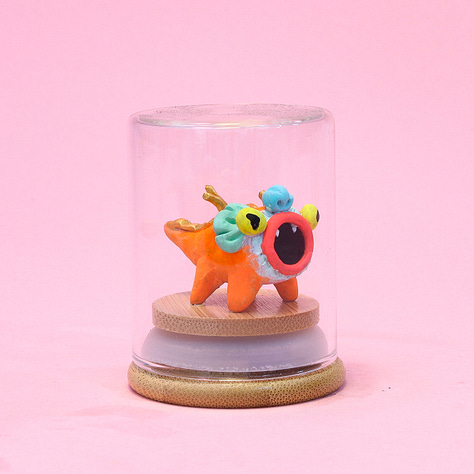 6 images of baby dragon sculptures each in a small glass jar