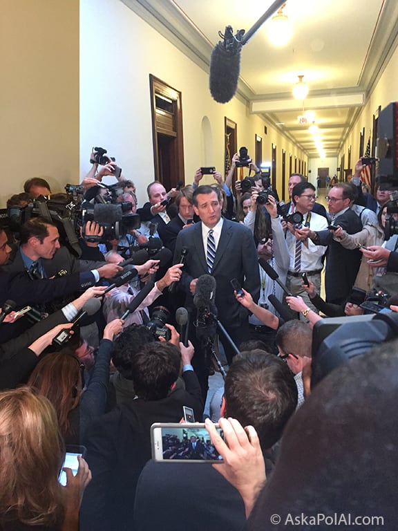 A Politician addresses a crowd of microphone holding reporters and videocameras at US Capitol. Photo: Matt Laslo © AskaPolAI.com A Politician addresses a crowd of microphone holding reporters and videocameras at US Capitol. Photo: Matt Laslo © AskaPolAI.com