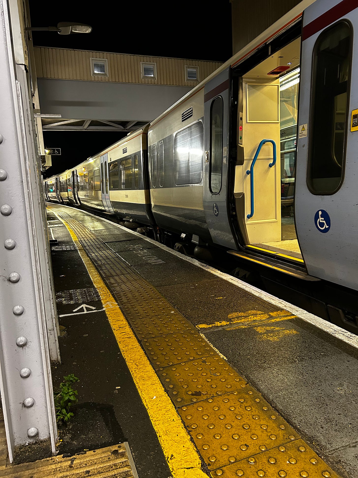 Southeastern train at a platform, door with wheelchair sign