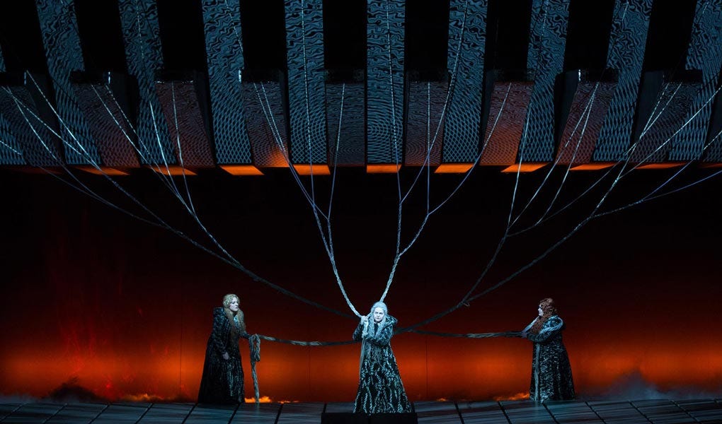 Götterdämmerung's performance at the Met Opera photo showing the Norse Norns, or goddesses of fate, weaving destiny.