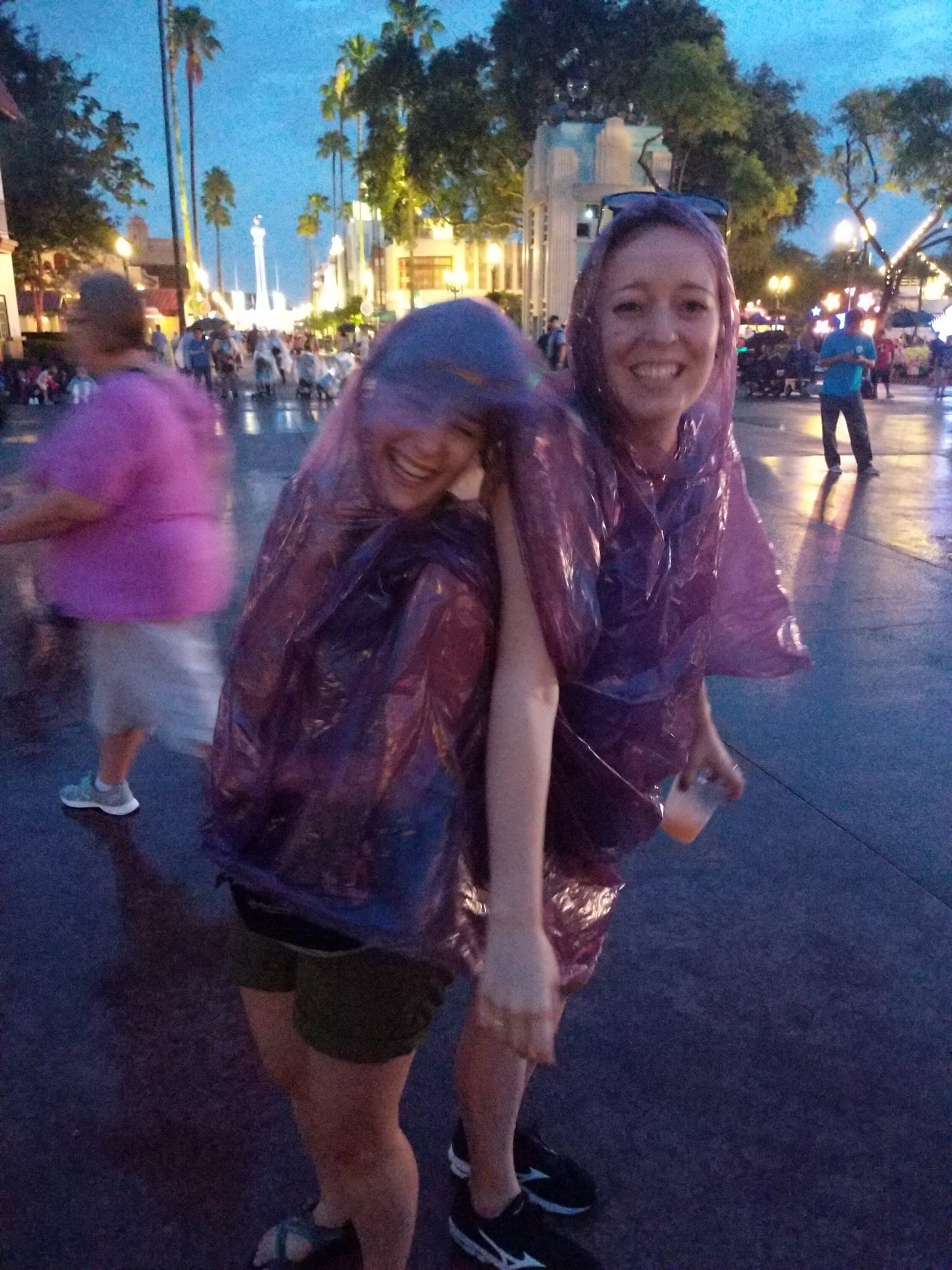 A less-than-perfect moment in the rain, with only one poncho.
