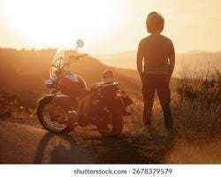 elderly man with glasses looking back at a winding path behind him outdoors sunset, AI generated