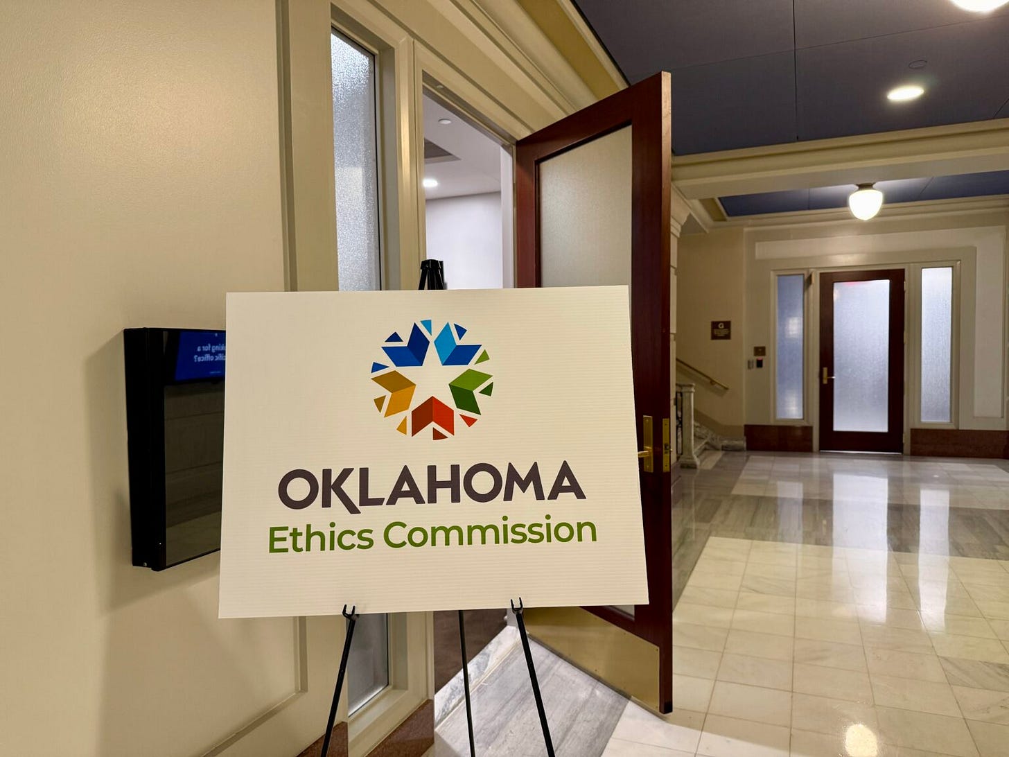  A sign stands outside the July 10, 2025 meeting of the Oklahoma Ethics Commission at the state Capitol in Oklahoma City. (Photo by Emma Murphy/Oklahoma Voice)