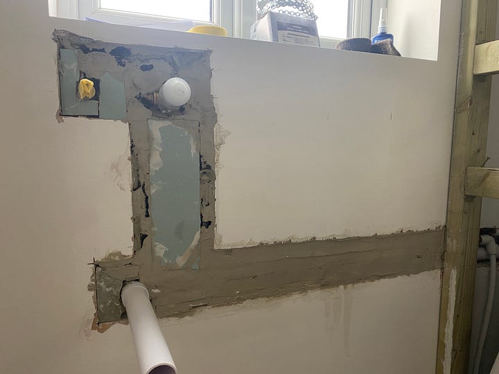 The holes in the wall have been filled out with plasterboard and bonding