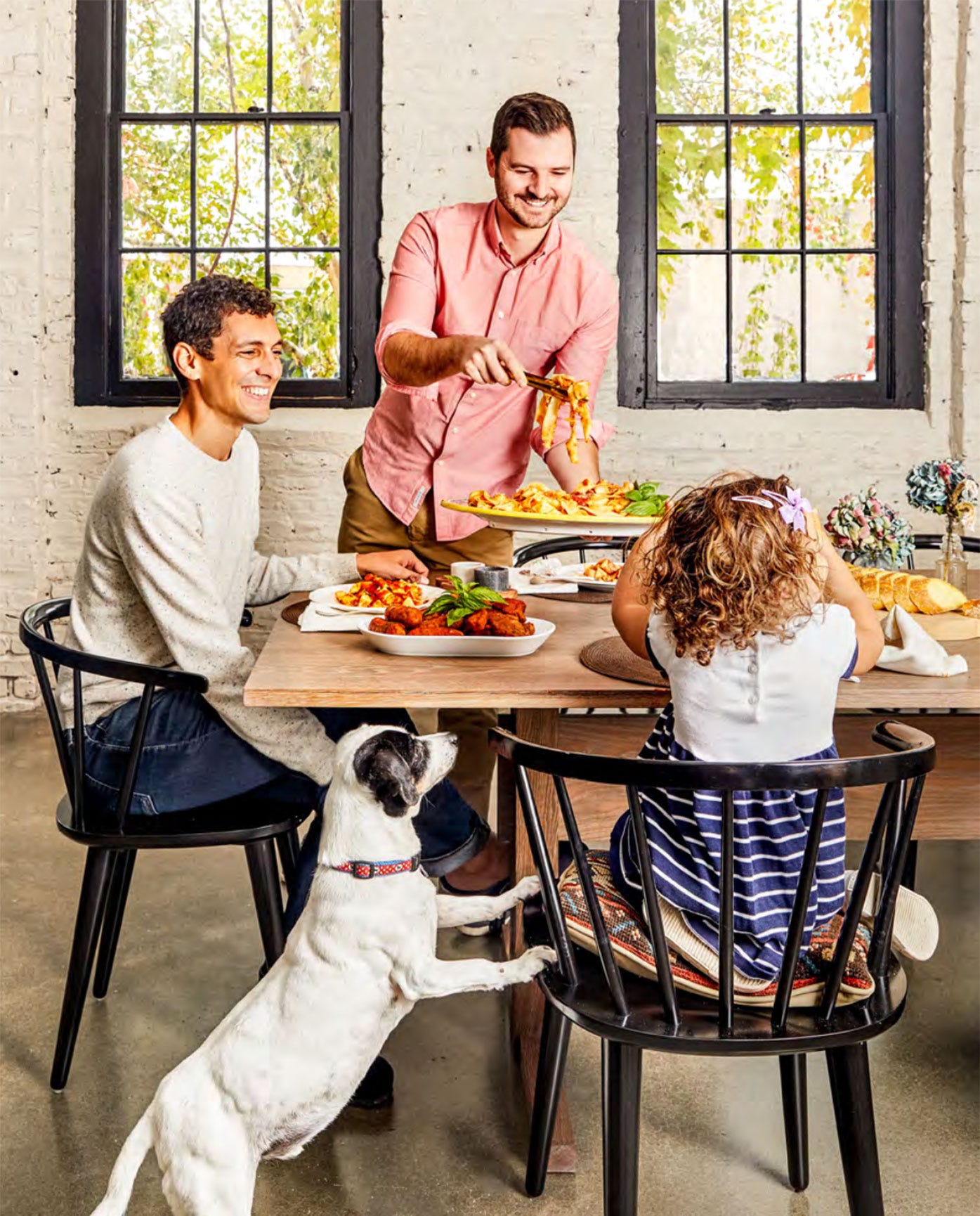 Danny and his family (before daughter #2!) eating pasta at the dining room table, photo by Rikki Snyder Danny and his family (before daughter #2!) eating pasta at the dining room table, photo by Rikki Snyder