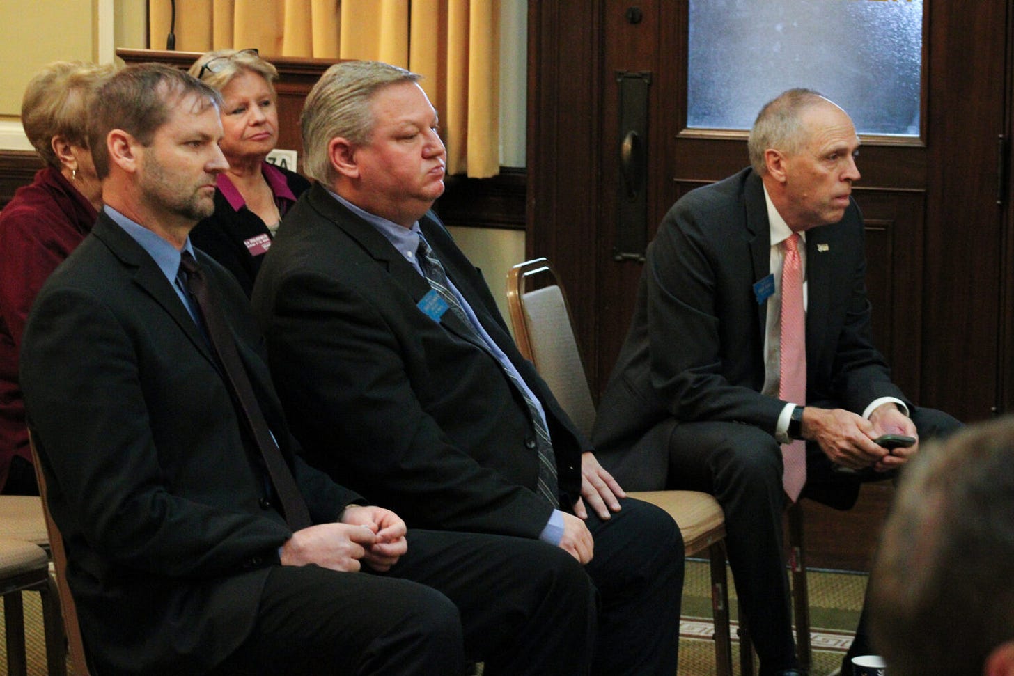 Sens. Matt Regier, Jason Ellsworth and Greg Hertz sit at a Republican Senate caucus meeting before giving their speeches seeking to be Senate President for 2025. (Photo by Blair Miller, Daily Montanan) Sens. Matt Regier, Jason Ellsworth and Greg Hertz sit at a Republican Senate caucus meeting before giving their speeches seeking to be Senate President for 2025. (Photo by Blair Miller, Daily Montanan)