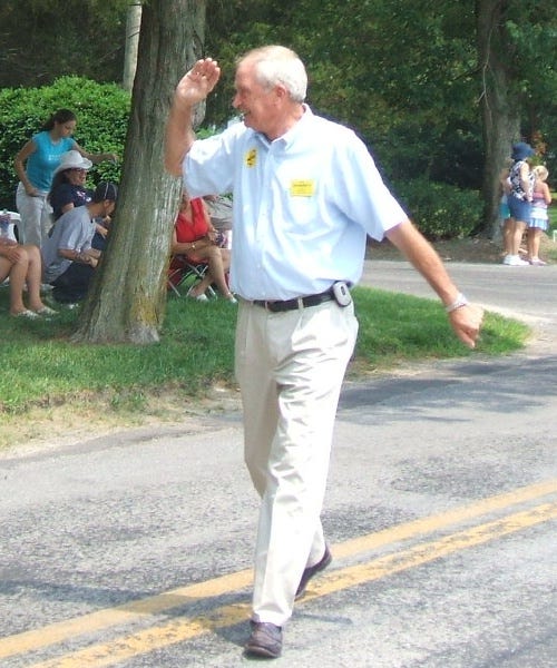 Sheriff candidate Kirk Daugherty walks the parade route. Sheriff candidate Kirk Daugherty walks the parade route.