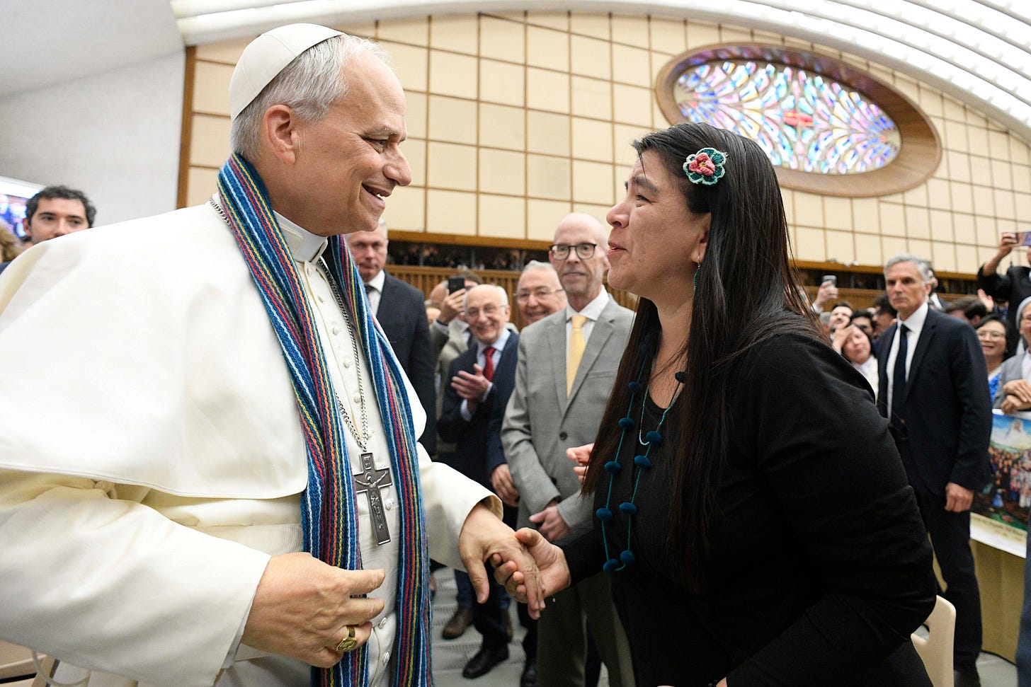 Paola Ugaz, a Peruvian journalist who helped expose the abuse committed by leaders of the Sodalitium Christianae Vitae, gives Pope Leo XIV a stole made of alpaca wool during the pope's meeting with members of the media on May 12 in the Paul VI Audience Hall at the Vatican. (CNS photo/Vatican Media) Paola Ugaz, a Peruvian journalist who helped expose the abuse committed by leaders of the Sodalitium Christianae Vitae, gives Pope Leo XIV a stole made of alpaca wool during the pope's meeting with members of the media on May 12 in the Paul VI Audience Hall at the Vatican. (CNS photo/Vatican Media)