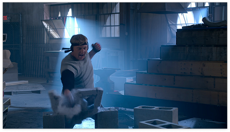Johnny breaking blocks, Miyagi-do on stage, Miguel vs Axel