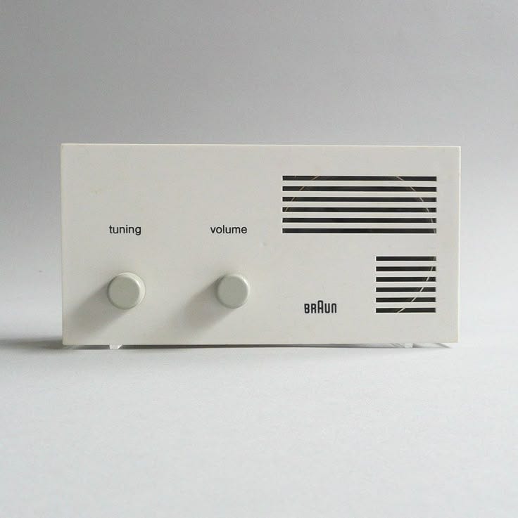 This may contain: an electronic device with two knobs on it
