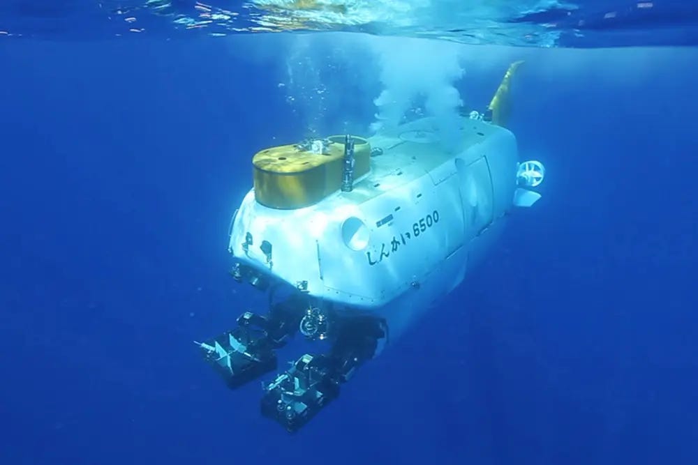 Japanese HOV submersible Shinkai 6500 submerging beneath the ocean surface