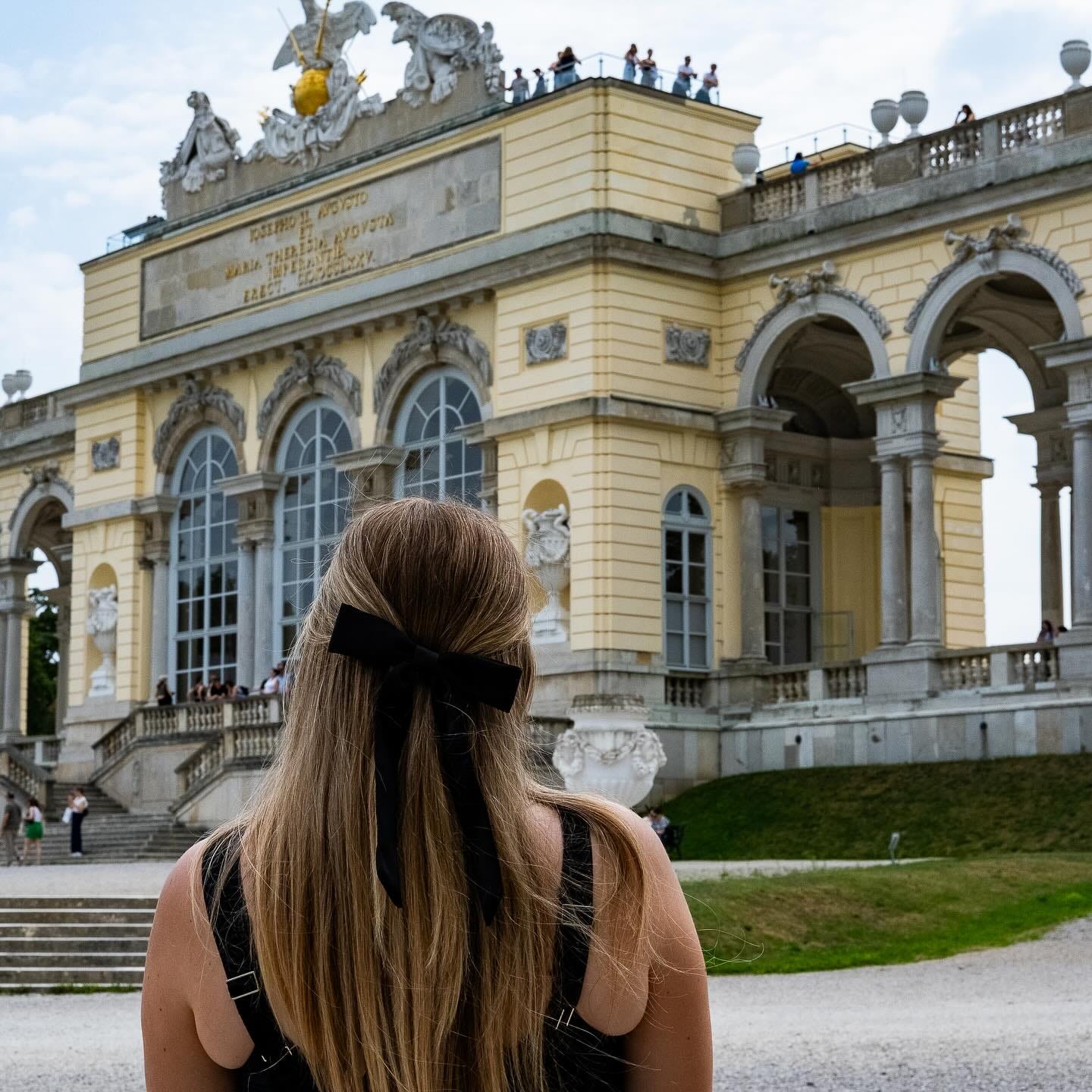 May be an image of 3 people and the Brandenburg Gate