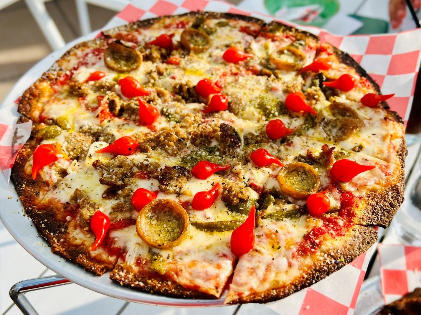 A pizza on a plate

Description automatically generated