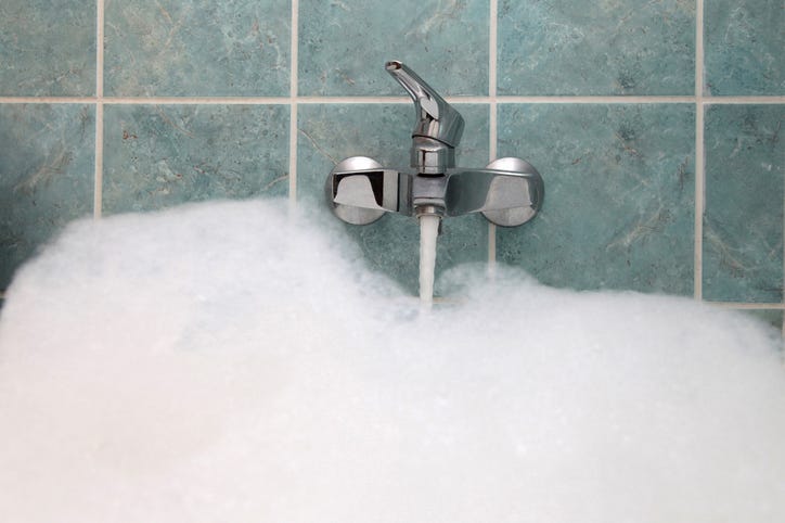 bathtub filling up with bubbles