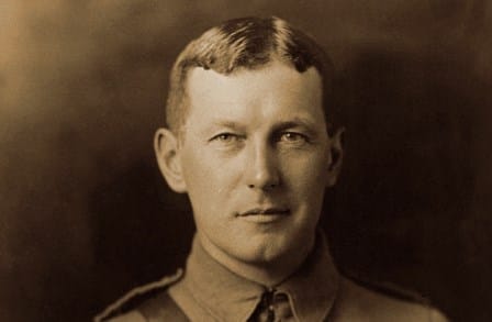 Sepia headshot of poet John Mccrae in uniform.