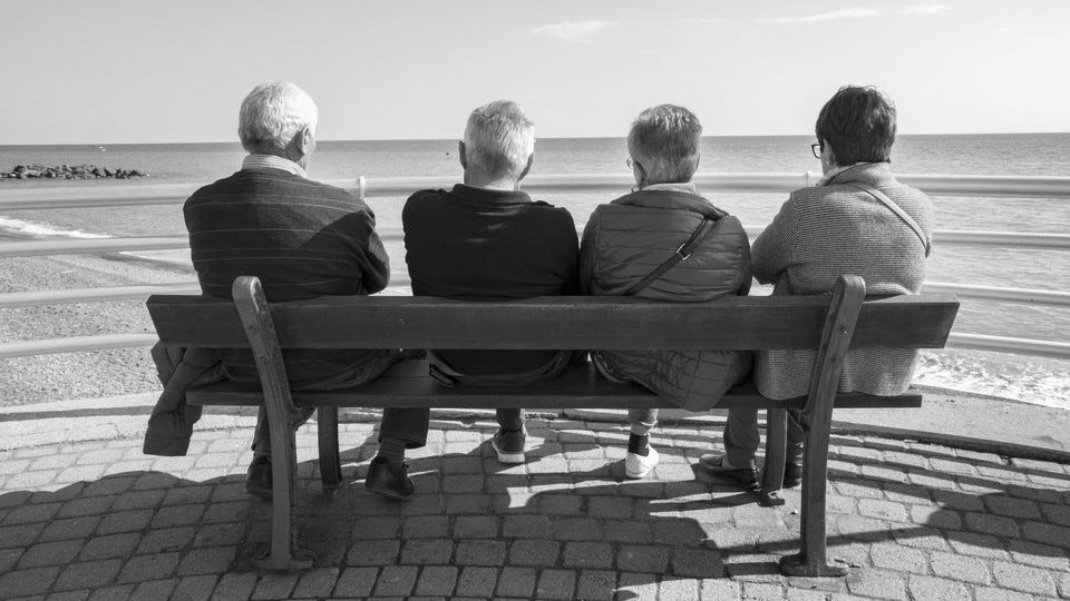A group of friends sitting on a bench