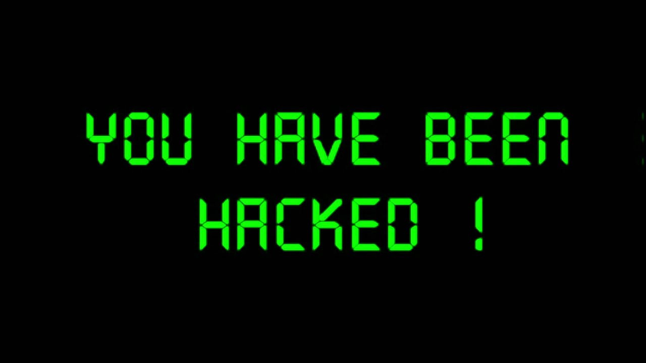 Fundo preto com mensagem em letras garrafais na cor verde, no tipo de fonte de prompts de comando: “YOU HAVE BEEN HACKED!”