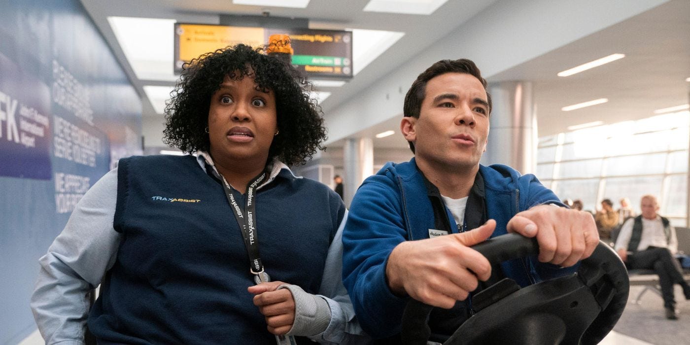 Natasha Rothwell and Conrad Ricamora ride in a cart in an airport in How to Die Alone.