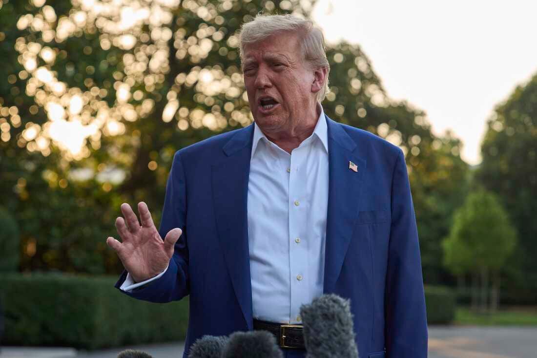 President Trump speaks with reporters before boarding Marine One on the South Lawn of the White House, Tuesday.