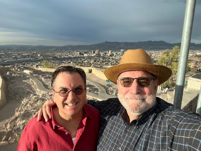 Two men taking a selfie

Description automatically generated