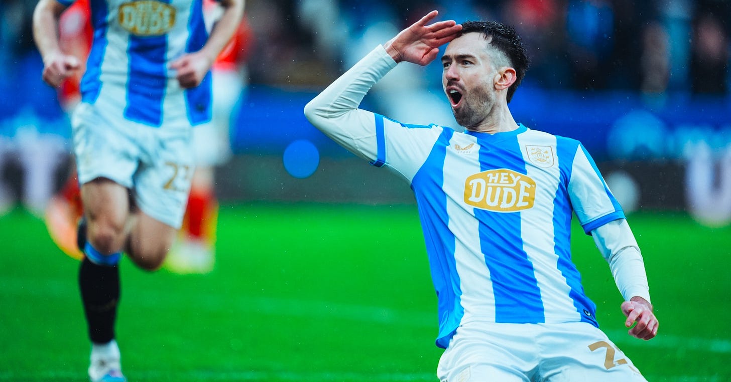 Huddersfield Town striker, Ryan Hardie, celebrates after scoring a goal against Barnsley. Huddersfield Town striker, Ryan Hardie, celebrates after scoring a goal against Barnsley.
